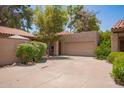 Well-maintained home with a two-car garage and a mature tree at 6422 N 77Th Way, Scottsdale, AZ 85250