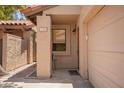 Welcoming front porch with a cozy seating area, and covered walkway at 6422 N 77Th Way, Scottsdale, AZ 85250