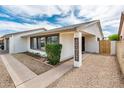 Exterior front porch featuring updated paint, modern windows and decorative 'Home Sweet Home' sign at 6627 S 42Nd Pl, Phoenix, AZ 85042