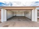 Spacious two car garage featuring shelving and lots of open space at 6627 S 42Nd Pl, Phoenix, AZ 85042