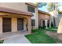 Inviting exterior view showcasing the home's archway porch and fresh green lawn at 7126 N 19Th Ave # 228, Phoenix, AZ 85021