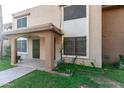 Exterior shot of a lovely townhouse highlighting the front lawn and covered porch at 7126 N 19Th Ave # 228, Phoenix, AZ 85021