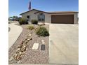 Charming single-story home with well-maintained landscaping and a two-car garage at 8840 E Sunland Ave # 142, Mesa, AZ 85208