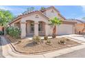 Charming single-story home featuring desert landscaping, a red tile roof, and a covered porch at 8884 E Arizona Park Pl, Scottsdale, AZ 85260