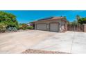 Spacious three-car garage and an expansive driveway provide ample parking at this home at 13034 W Krall Ct, Glendale, AZ 85307