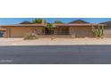 Charming single-story brick home featuring desert landscaping, a front patio, and an attached two-car garage at 132 W Wood Dr, Phoenix, AZ 85029