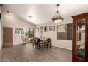 Bright dining room showcasing hardwood floors and decor, with plenty of natural light at 17201 E Hillcrest Dr, Fountain Hills, AZ 85268