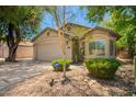 Exterior elevation featuring a two-car garage with low maintenance landscaping at 20044 N 30Th Pl, Phoenix, AZ 85050