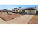 Inviting single-story home with a private driveway, offering both convenience and curb appeal in a friendly neighborhood at 2204 E Birchwood Ave, Mesa, AZ 85204