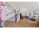 Bright and airy living space with hardwood floors and a staircase at 2258 N Gentry --, Mesa, AZ 85213