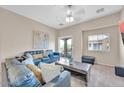 Inviting living room with cozy seating, natural light, and a sliding glass door leading to outdoor space at 2727 N Price Rd # 6, Chandler, AZ 85224