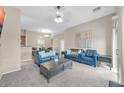 Open-concept living room featuring neutral tones, comfortable furniture, and an inviting atmosphere for relaxation at 2727 N Price Rd # 6, Chandler, AZ 85224