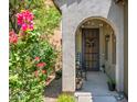 Welcoming front porch with decorative plants, seating, and charming decor at 3766 E Ringtail Way, Phoenix, AZ 85050