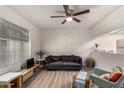 Bright living room with ceiling fan, stylish rug, and comfortable seating arrangement at 461 W Holmes Ave # 350, Mesa, AZ 85210