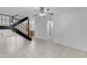 Open-concept living space with tile floors, a modern staircase, and natural light at 527 N Lesueur --, Mesa, AZ 85203