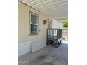 View of covered carport of the mobile home, with space for car and storage at 7920 W Glendale Ave # 39, Glendale, AZ 85303