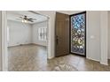Elegant foyer with decorative tile flooring and view into the living room at 1125 E San Carlos Way, Chandler, AZ 85249