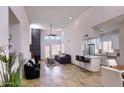 Bright living area with high ceilings, fireplace, and open concept to kitchen at 11333 N 92Nd St # 1118, Scottsdale, AZ 85260