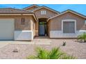 Well-maintained home featuring desert landscaping, a neatly kept yard, and a welcoming entryway at 1144 E Nunneley Rd, Gilbert, AZ 85296