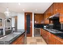 Updated kitchen showcases granite counters, stainless appliances, custom cabinets, and a wine refrigerator at 120 E Rio Salado E Pkwy # 102, Tempe, AZ 85281