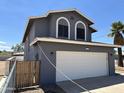 Charming two-story home with a two-car garage and fenced yard at 121 N Brown Ave, Casa Grande, AZ 85122