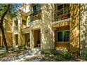 Charming condo with multiple balconies, complemented by a small landscaped front yard at 121 N California St # 35, Chandler, AZ 85225