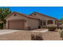 Well-maintained single-story home with desert landscaping and a spacious two-car garage at 1282 N Banning St, Gilbert, AZ 85234