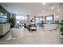 Open-concept living and dining area with modern decor and plenty of natural light at 13195 N 145Th Ln, Surprise, AZ 85379