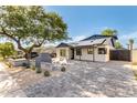 Charming home featuring solar panels, a landscaped yard, and a modern desert vibe at 1338 E Granada Rd, Phoenix, AZ 85006