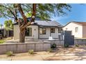 Charming home featuring solar panels, a landscaped yard, and a modern desert vibe at 1338 E Granada Rd, Phoenix, AZ 85006