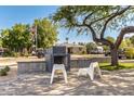 Landscaped front yard with outdoor seating and desert landscaping at 1338 E Granada Rd, Phoenix, AZ 85006
