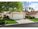 Charming single-story home with a two-car garage, well-maintained lawn, and attractive landscaping at 18780 N 94Th Ave, Peoria, AZ 85382