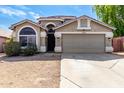 Attractive home boasts a clean exterior with a two-car garage and desert landscaping at 20038 N 38Th Ln, Glendale, AZ 85308