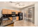 Functional kitchen with stainless steel appliances, granite countertops and backyard access at 2063 S Edgewater --, Mesa, AZ 85209