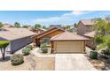 Charming home featuring desert landscaping, a two-car garage, and a tile roof in a sunny neighborhood at 25840 W Whyman St, Buckeye, AZ 85326