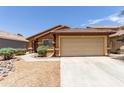Charming single Gathering home with a 2-car garage, desert landscaping, and well-maintained front yard at 25840 W Whyman St, Buckeye, AZ 85326