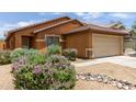 Beautiful single-Gathering house boasting desert landscaping and an attached 2-car garage at 25840 W Whyman St, Buckeye, AZ 85326