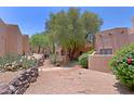 Exterior courtyard view showcasing landscaping and architecture at 38065 N Cave Creek Rd # 2, Cave Creek, AZ 85331