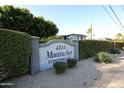 Community sign reading '4224 Montrachet Condominiums' set among lush landscaping at 4224 N 12Th St # 108, Phoenix, AZ 85014