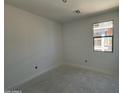 A bedroom with 1 window is shown at 46868 W Old Timer Rd, Maricopa, AZ 85139