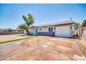 Charming single-story home with a well-maintained front yard, driveway, and a one-car garage at 5236 S 19Th Ave, Phoenix, AZ 85041
