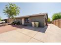 Home with gravel front yard and extra-long concrete driveway at 5637 N 63Rd Dr, Glendale, AZ 85301