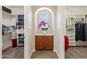 Well-organized walk-in closet with built-in shelving and storage, providing ample space for clothing and accessories at 7939 W Fetlock Trl, Peoria, AZ 85383