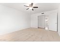 A bright bedroom with carpet flooring with a ceiling fan to keep you cool and comfortable at 8807 W Cinnabar Ave, Peoria, AZ 85345