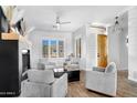 Bright living room offering plank flooring and a view of the front yard at 9545 E Gary St, Mesa, AZ 85207