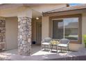 Inviting front porch with comfortable seating and stone column accents at 11360 E Keats Ave # 20, Mesa, AZ 85209