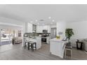 Bright, modern kitchen with white cabinets, stainless steel appliances, and a center island at 1561 N Sterling St, Mesa, AZ 85207