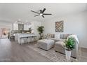 Open-concept living room and kitchen area with hardwood floors and neutral decor at 1561 N Sterling St, Mesa, AZ 85207