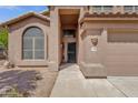 Inviting entrance showcasing the front door with a covered porch and well-maintained walkway at 17204 E Kensington Pl, Fountain Hills, AZ 85268