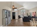 Bright living room with vaulted ceilings, large windows, and tile floors, offering a comfortable space at 17204 E Kensington Pl, Fountain Hills, AZ 85268